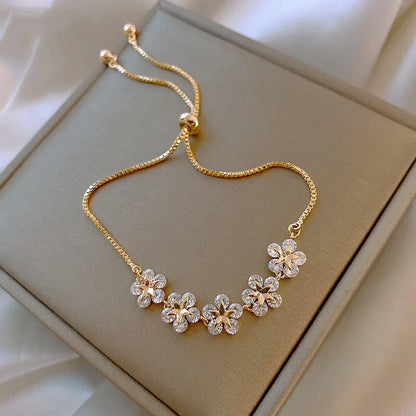 Elegant Gold Flower Charm Bracelet with Rhinestones – Chic & Trendy