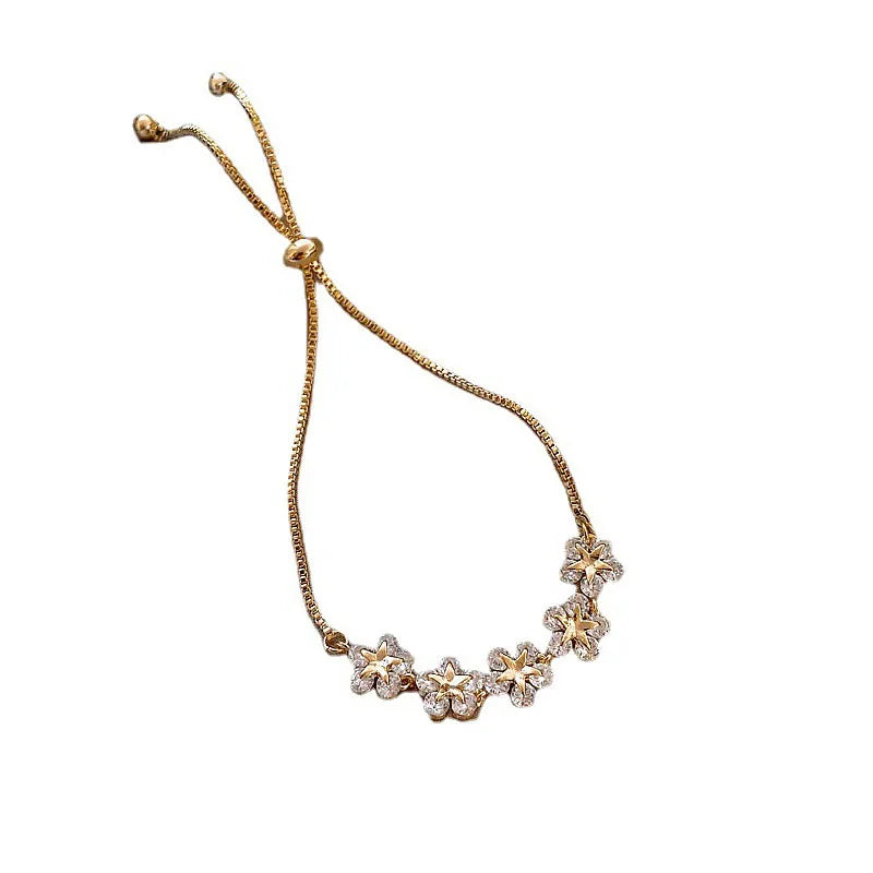 Elegant Gold Flower Charm Bracelet with Rhinestones – Chic & Trendy