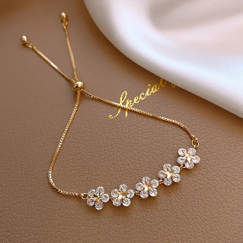 Elegant Gold Flower Charm Bracelet with Rhinestones – Chic & Trendy