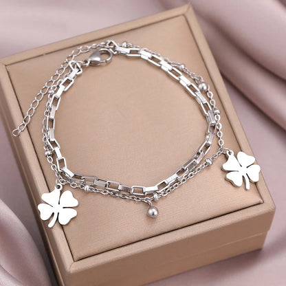 Elegant Bell Clover Pendant Bracelet – Stainless Steel & Bead Detailing