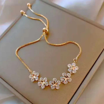 Elegant Gold Flower Charm Bracelet with Rhinestones – Chic & Trendy